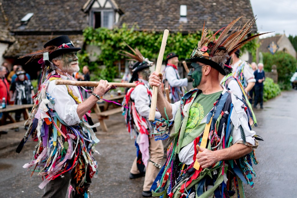 Alvechurch Morris Men dancing with sticks in tatters
